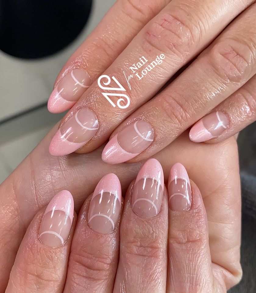 A soft pink French manicure by our techs