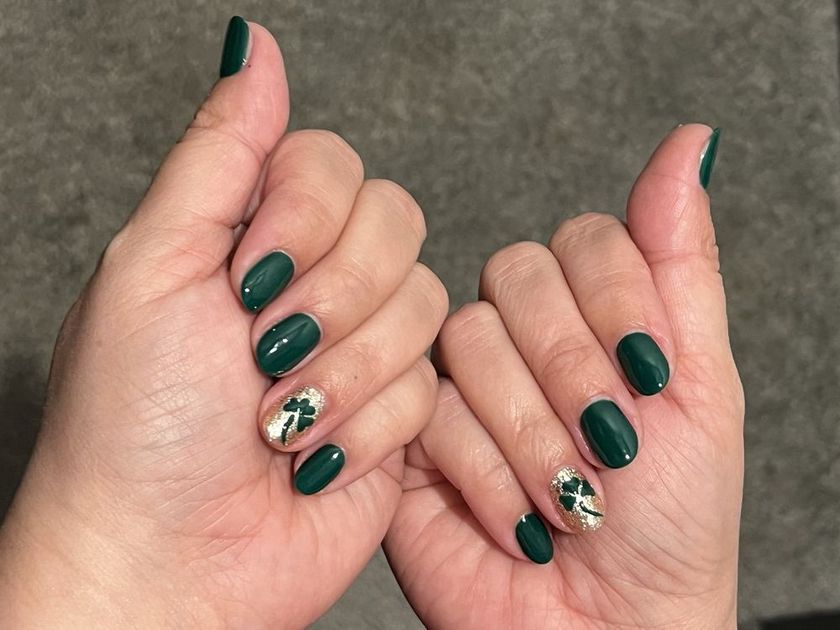 A short, simple manicure in deep green