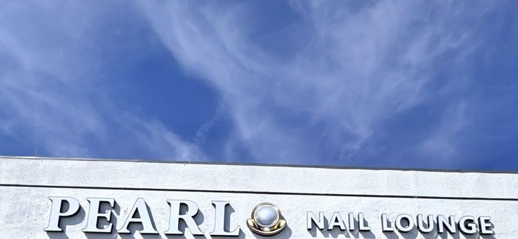 The Pearl Nail Lounge sign above our storefront on Colorado Blvd